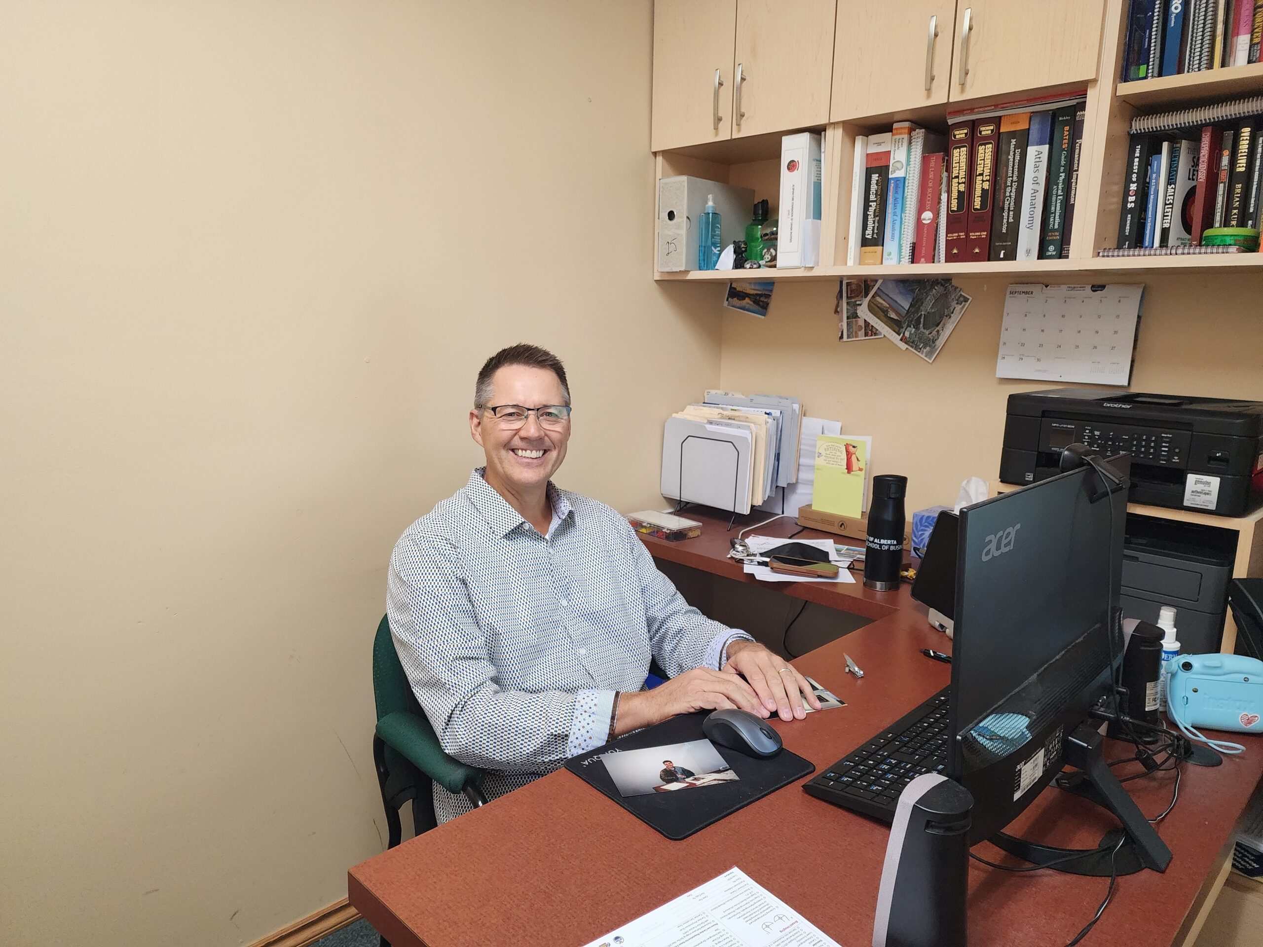 Dr. Todd Berg back in 2025 on his last day of work sitting at his desk